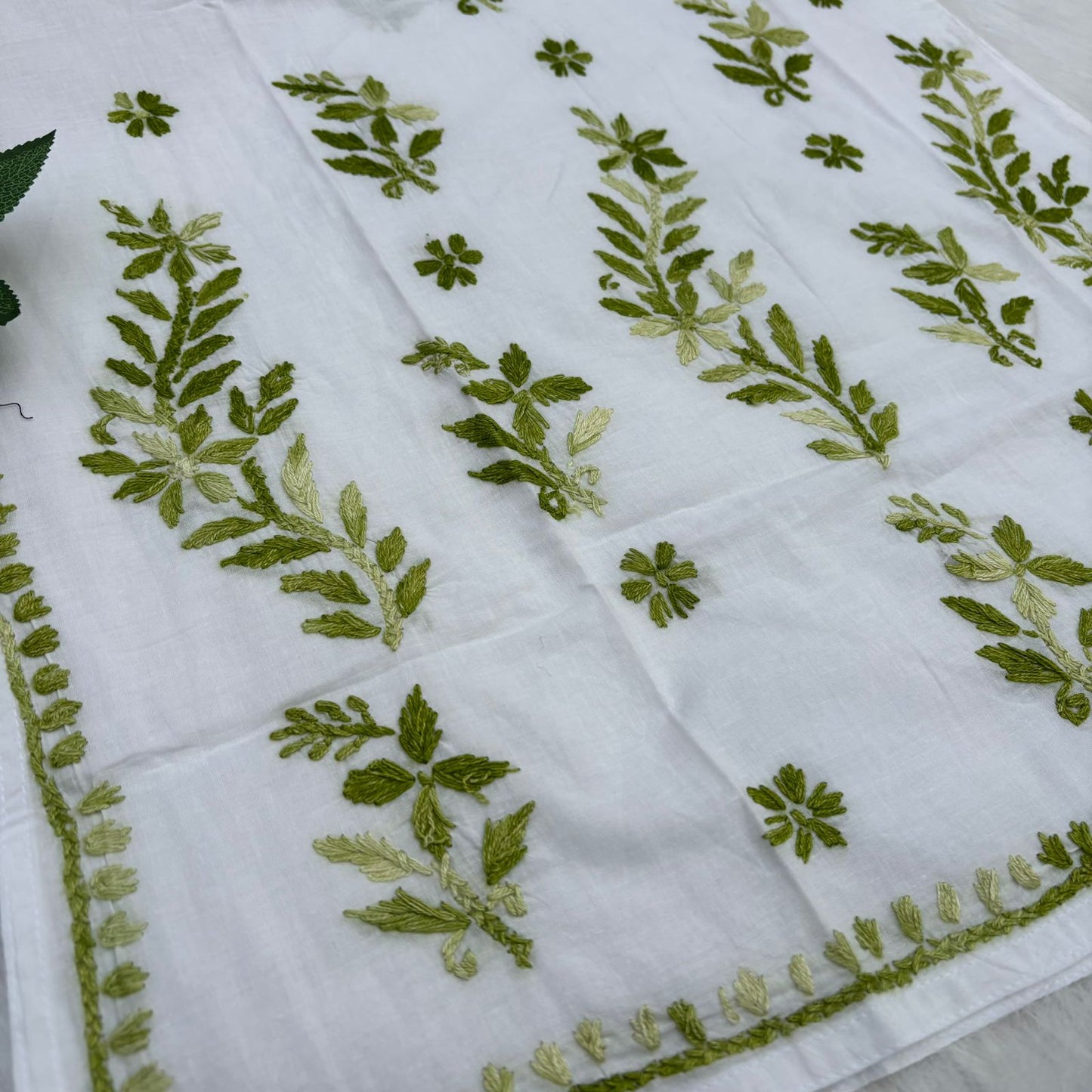 Naaz White Base Pure Mulmul Chikankari Short Kurti with Color Threadwork